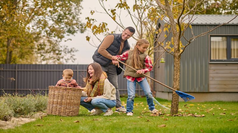 Family maintaining a small backyard using DecorAdHouse Garden Tips by DecoratorAdvice for smart garden design